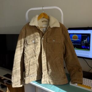 Cozy corduroy trucker-style jacket with plush sherpa lining.
